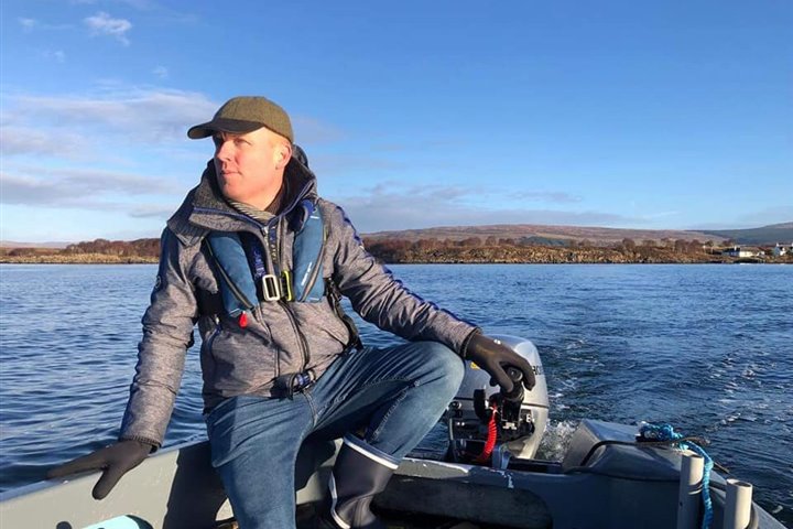 Philip Smith on a boat near the Isle of Mull